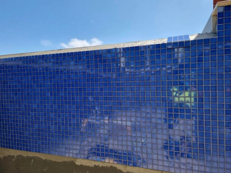 Swimming pool tiling